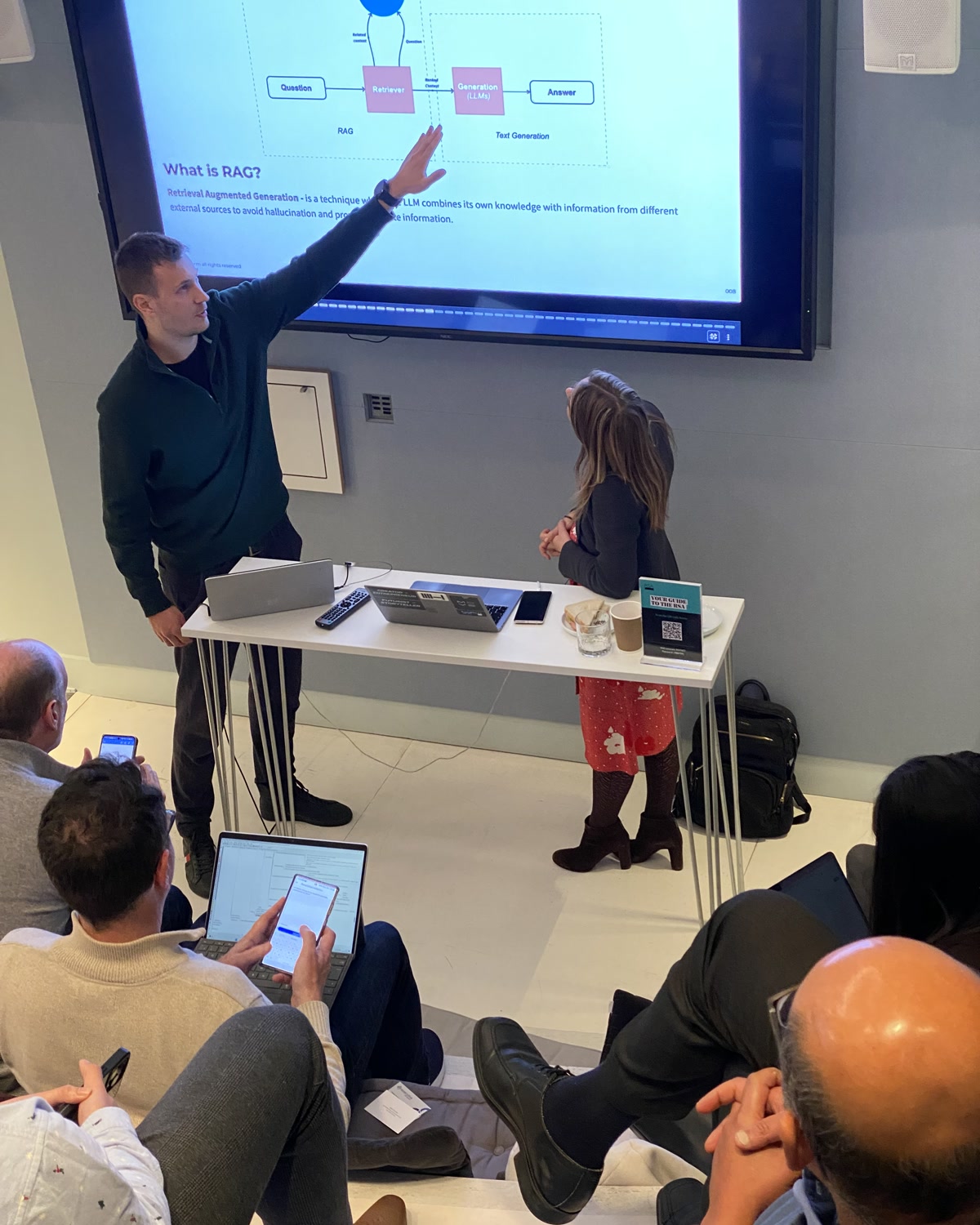 Antoni Kozelski on the build floor, walking a team through a RAG architecture