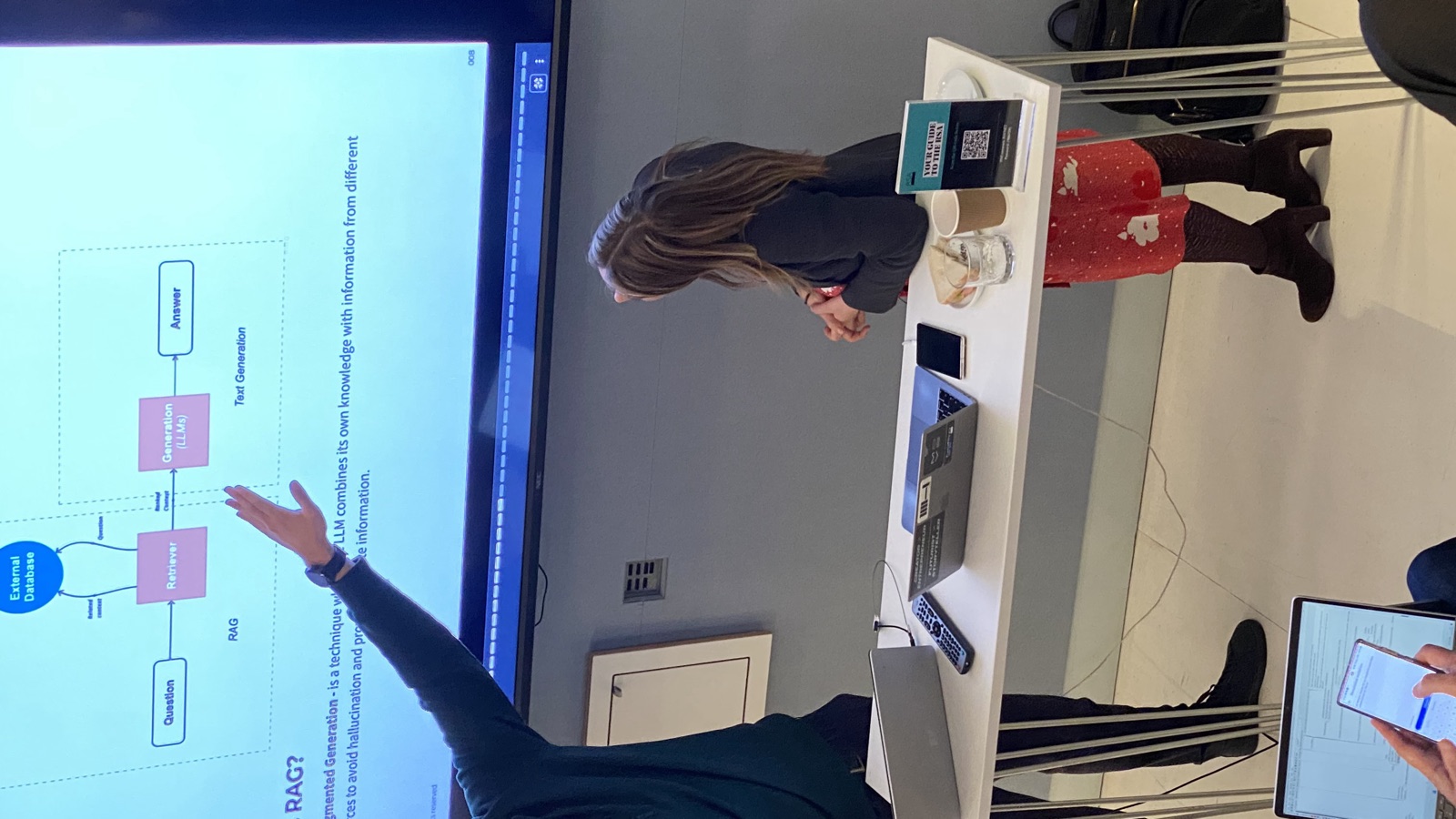 Antoni Kozelski presenting retrieval-augmented generation to a seated audience